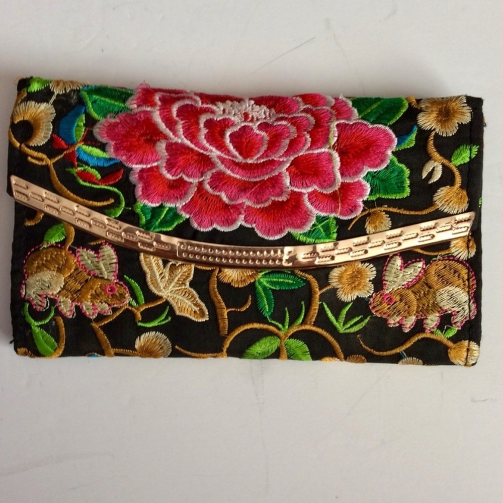 Embroidered bunny and carnation satin wallet.